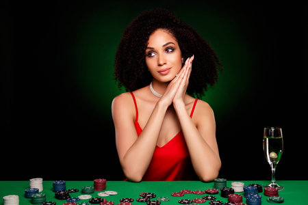 Photo of dreamy adorable fancy lady in poker club plying with professionals isolated on dark green backgroundの写真素材