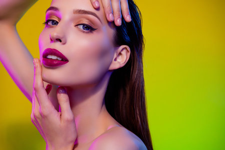 Close up photo of passionate attractive girl touch enjoy bright neon makeover for event in private disco partyの写真素材
