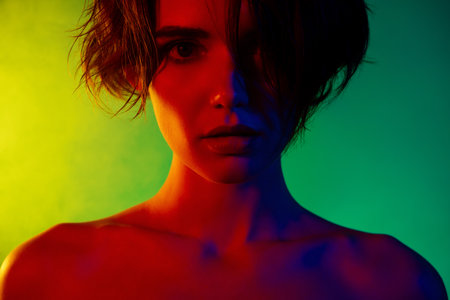 Close up photo of woman look mysteriously feel passion isolated over colorful neon backgroundの写真素材