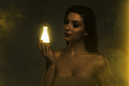 Artwork collage of stunning lovely girl arm hold glowing light golden bottle isolated on dark foggy backgroundの写真素材