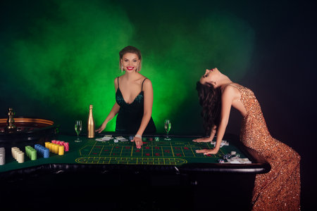 Photo of attractive chic vip girls poker players have fun in las vegas winning million jackpotの写真素材