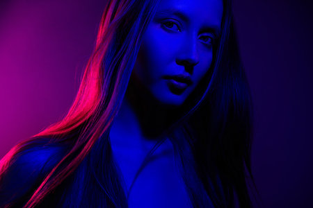 Photo of attractive girl with long hairstyle look feel tempting passion isolated multicolor backgroundの写真素材