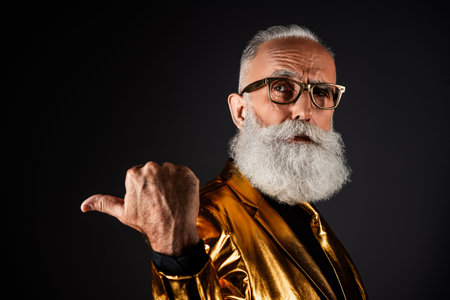 Photo of classy wealthy businessman look demosntrate dark color background empty space wear stylish...