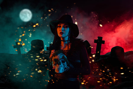 Surreal artwork collage of dark witch lady hold human skull over full moon night misty background graveyard pictureの写真素材