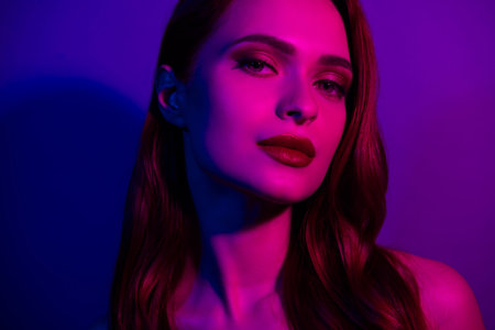 Photo of lovely gorgeous girl celebrity isolated on neon ultraviolet dark light background