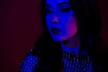 Photo of stunning beautiful hot girlfriend maiden isolated on dark red color backgroundの写真素材