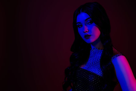 Photo of stunning beautiful lady feel passion flirt empty space isolated on dark red color...
