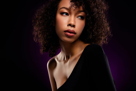 Photo of stunning gentle tender lady wear black bodysuit isolated on dark purple backgroundの写真素材