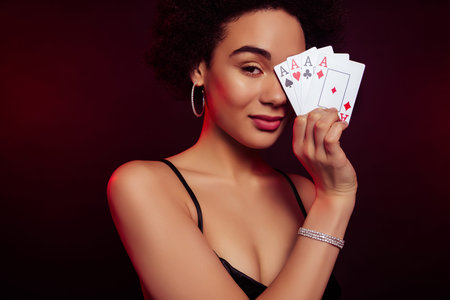 Photo of rich wealthy woman poker shark playing game isolated on dark red color background