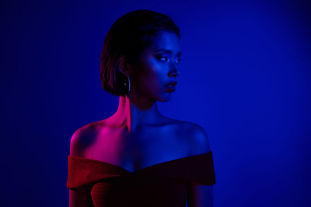 Photo of sweet adorable lady wear off shoulders dress looking empty space dark blue color background