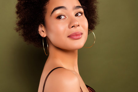 Close up photo of gentle tender charming lady ideal makeover isolated on khaki color backgroundの写真素材