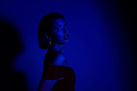 Photo of delicate adorable lady wear off shoulders dress empty space isolated blue background
