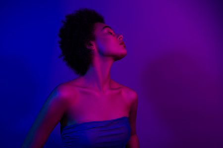 Photo of stunning gorgeous tender lady enjoy event night club party isolated on neon purple color backgroundの写真素材