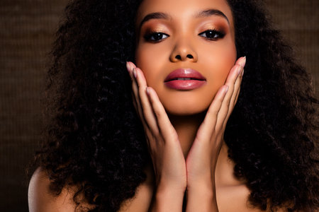 Portrait of a Glamorous Young Woman Showcasing Beauty, Style, and Elegant Makeup in a Studio Shootの写真素材