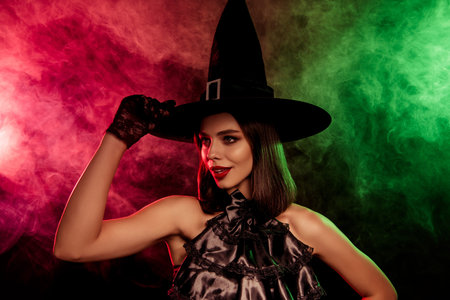Glamorous witch in elegant attire with enchanting background and mystical vibes for Halloween...