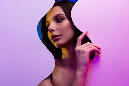 Stylish Portrait of a Woman with Neon Lights and Colorful Background Featuring Elegance and Modern Beautyの写真素材