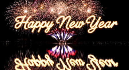 Happy new year 2015 written with Sparkle firework and reflection on waterの素材