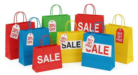 a group of colorful shopping bags with sale and discount offers displayed on them against a white backdropの素材