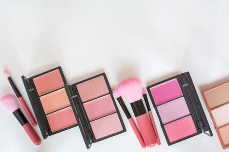 top view various makeup blushers tone and pink brushes on white background