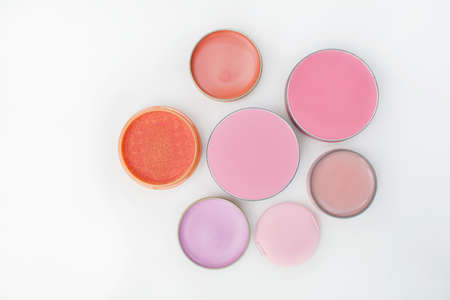 top view beautiful vivid various lip and blushers item makeup kit on white backgroundの写真素材
