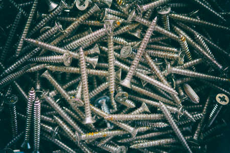 vintage dark tone top view dirty screws backgroundの写真素材