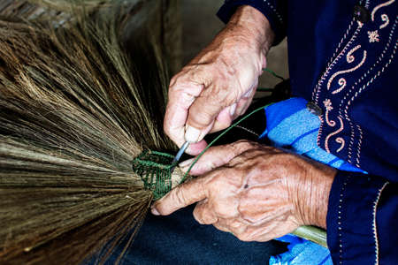 thailand cultural,handmake broom making with old man handsの写真素材