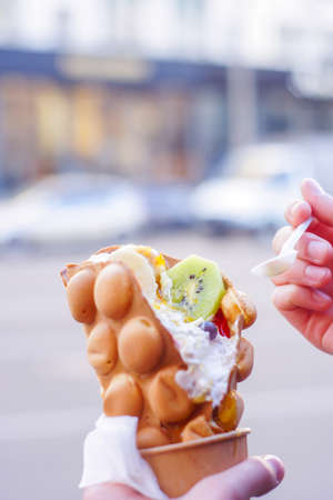 Hong Kong style egg waffle on green background.の写真素材