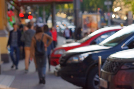 Blurred unfocused city view at day time. Unfocused people in the theme park