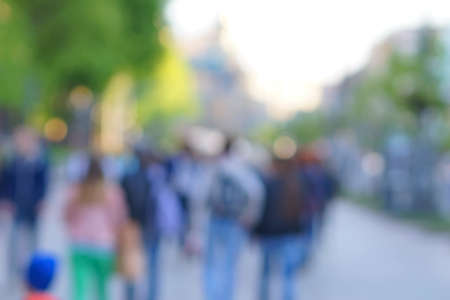 Blurred unfocused city view at day time. Unfocused people in the theme parkの写真素材