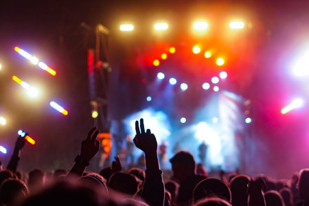 Girl on shoulders in the crowd at a music festival.