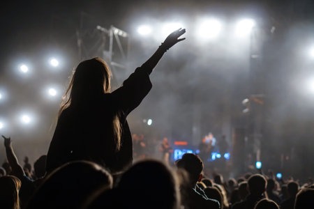 Girl on shoulders in the crowd at a music festival.