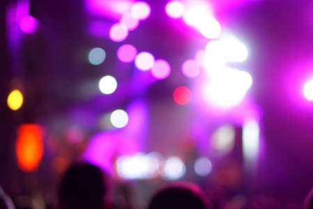 Defocused entertainment concert lighting on stage, blurred disco party.の写真素材
