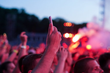 Close up of photographing with smartphone during a concert
