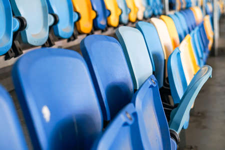 Close up of The Stadium seat colorful. Plastic seat rows at the Arena. Pattern texture of set chairs with empty. The Amphitheater. Sports.の写真素材