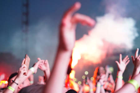 concert background, hand up , blurry background, beautiful bokeh live concertの写真素材