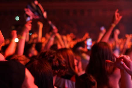 concert background, hand up , blurry background, beautiful bokeh live concertの写真素材