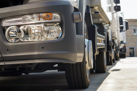 White trucks stand in line front view