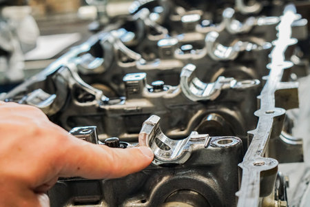 Close up of parts in engine head 4 valve system