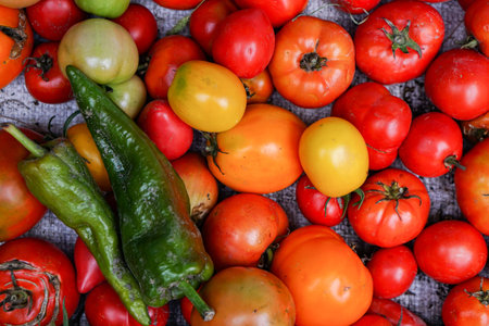 Delicious red tomatoes. Summer tray market agriculture farm full of organic vegetables It can be...