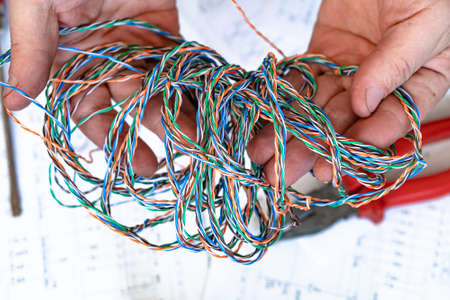 Various electrical tools and wires on a paper diagram, composition about home electricsの写真素材