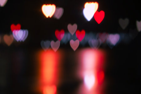 Valentine's day background. Heart bokeh background, Blurred background. Night city lights blur.Abstract image of blur motion of cars on the city road at nightの写真素材
