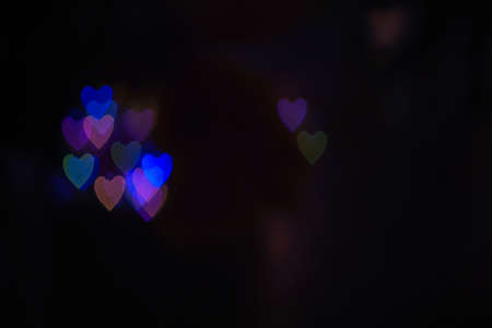 Heart bokeh background, Blurred background. Night city lights blur.Abstract image of blur motion of cars on the city road at nightの写真素材