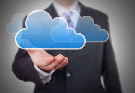Businessman showing a Cloud