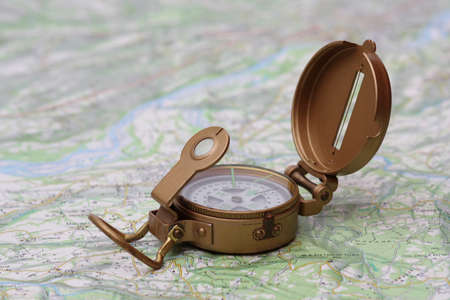 Brass compass on a topographic mapの写真素材