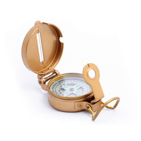 Brass compass over a white backgroundの写真素材