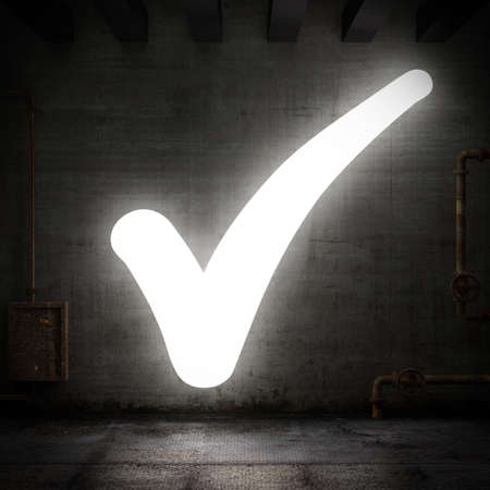 Luminous check mark in a grunge roomの写真素材