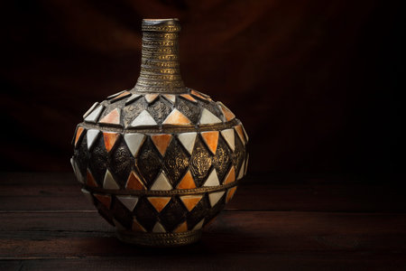 Antique Moroccan vase on an old dark tableの写真素材