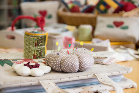 Sewing tools and quilt works on a table