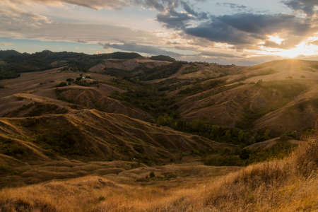 Beautiful Italian hills at sunset from Tuscanyの写真素材