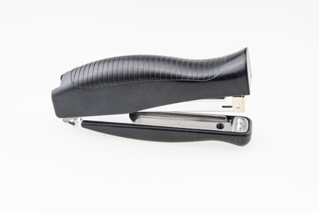 Black professional stapler isolated on white backgroundの写真素材